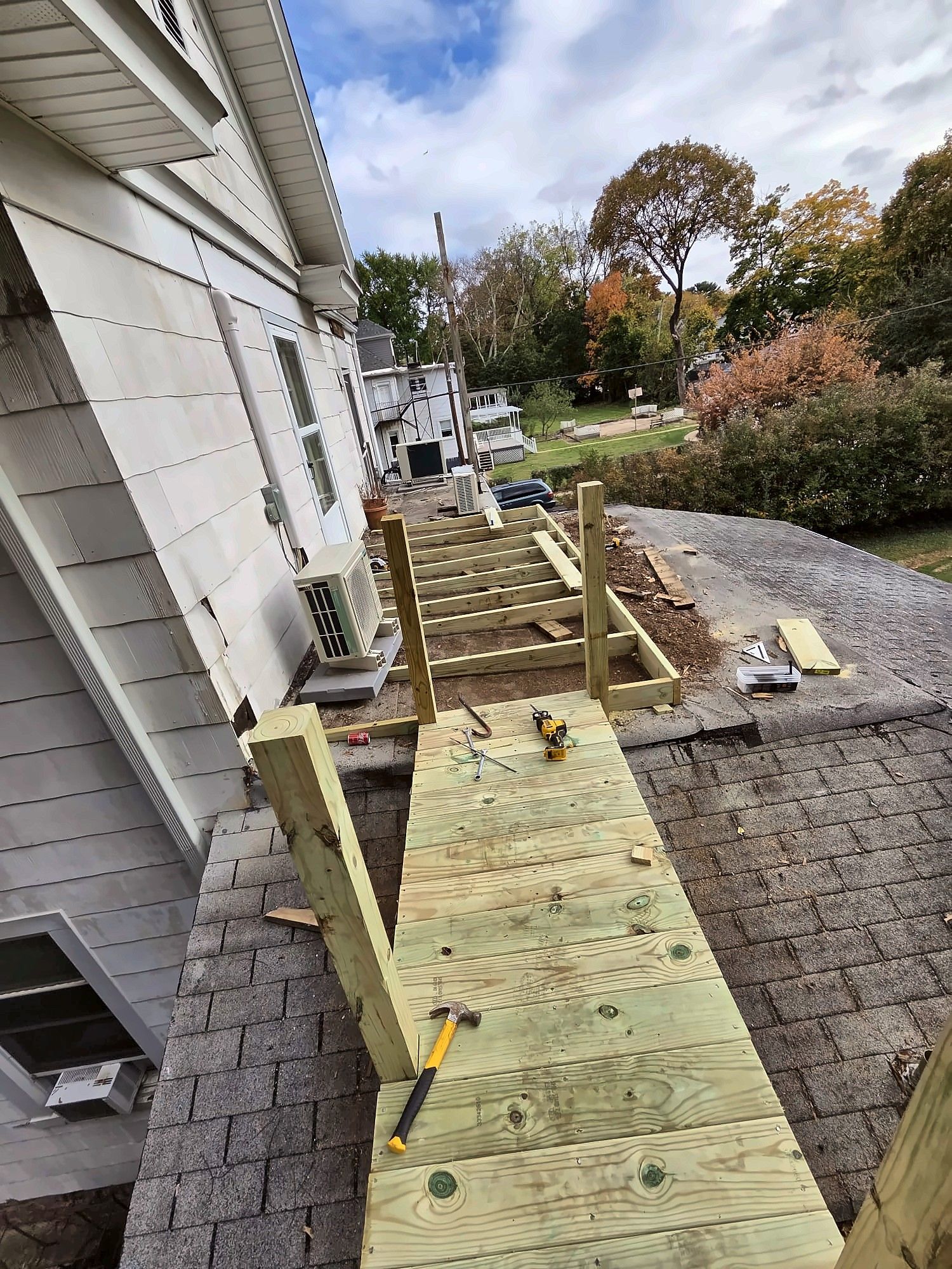 Building a wood deck walkway over a roof