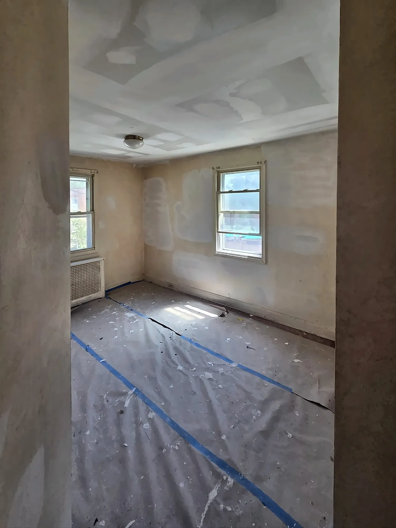 Bedroom with fresh drywall during renovation