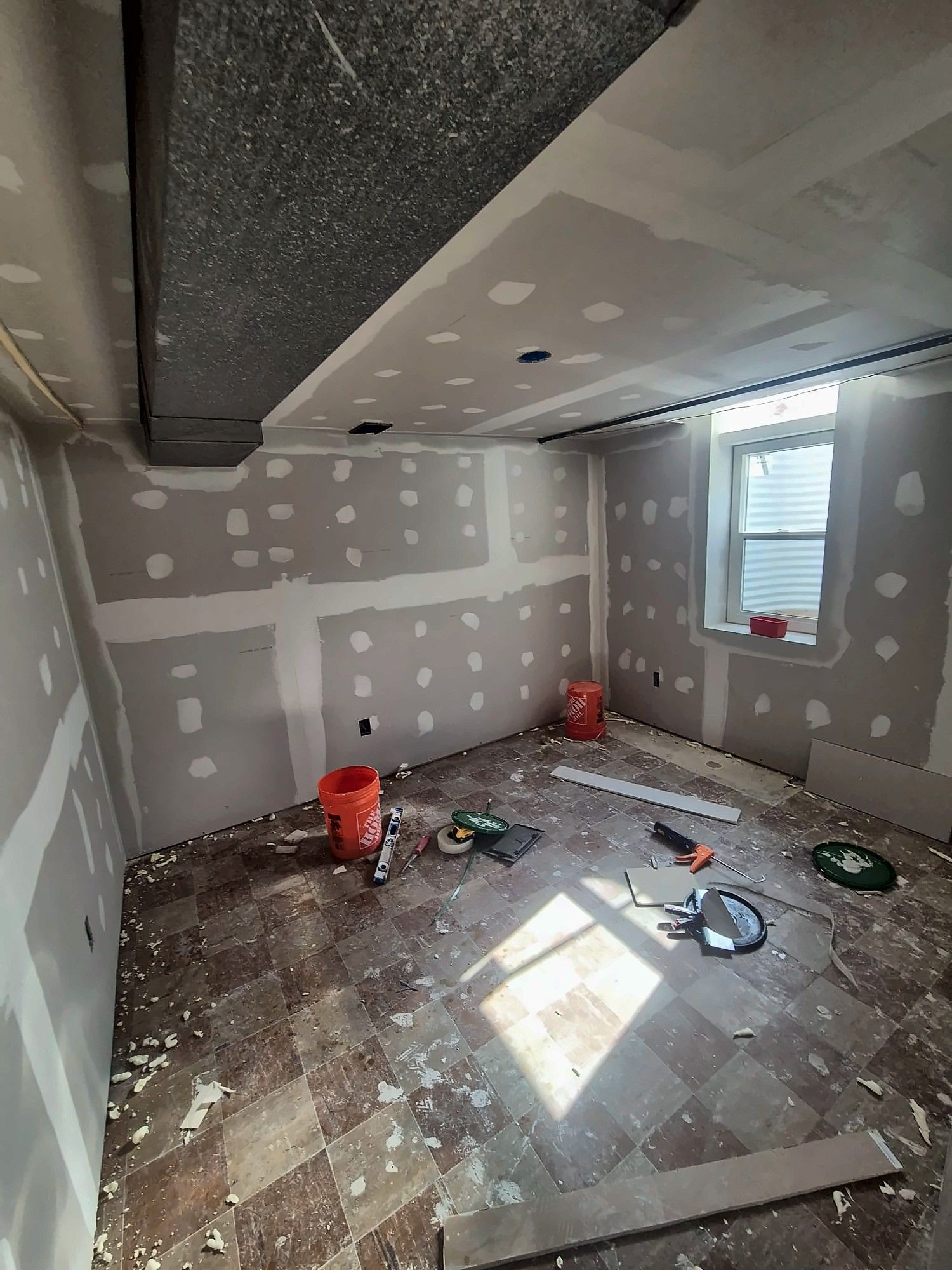 Room with drywall patched during renovation