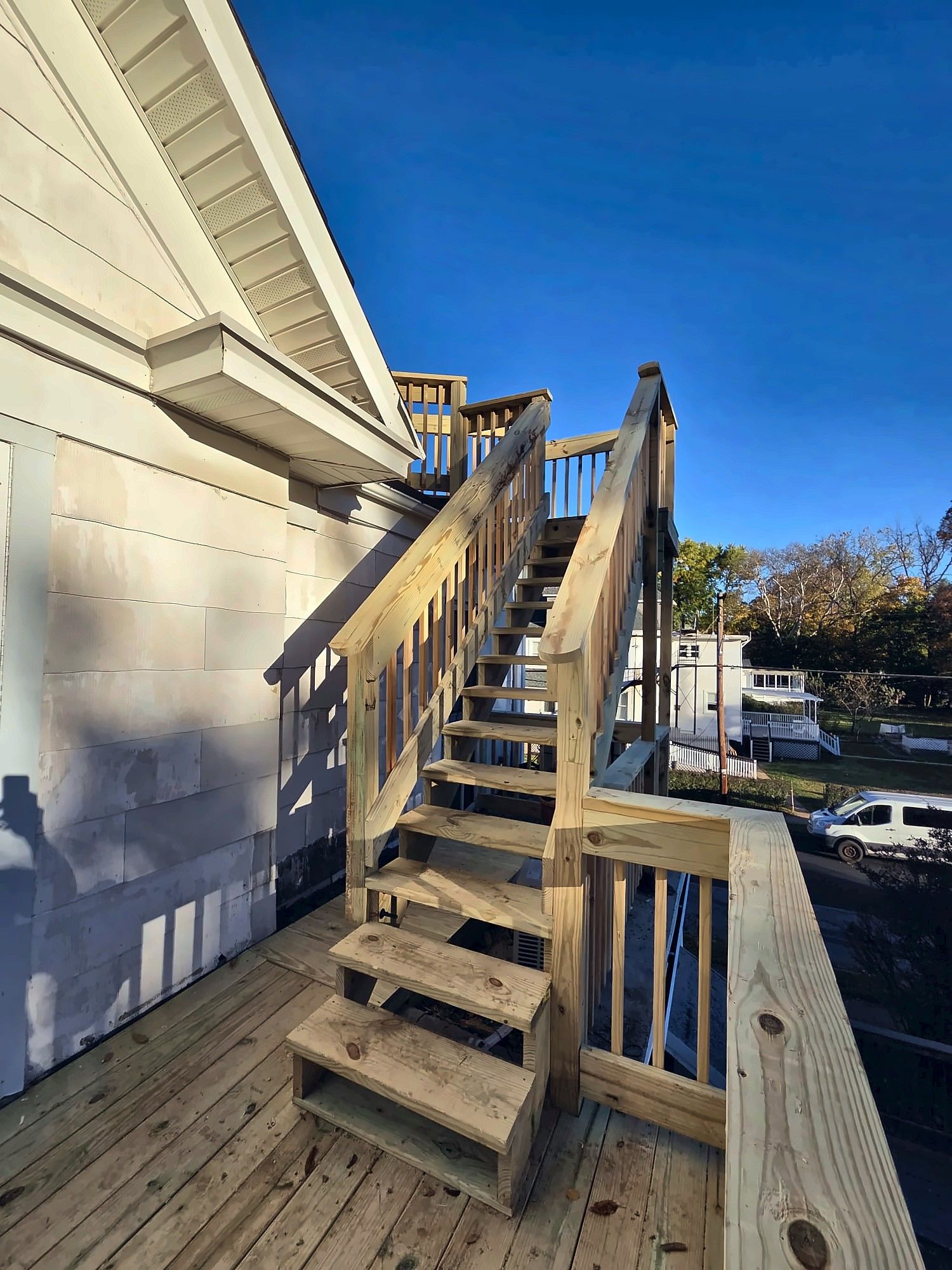 Exterior wood stairs to a second-floor entry