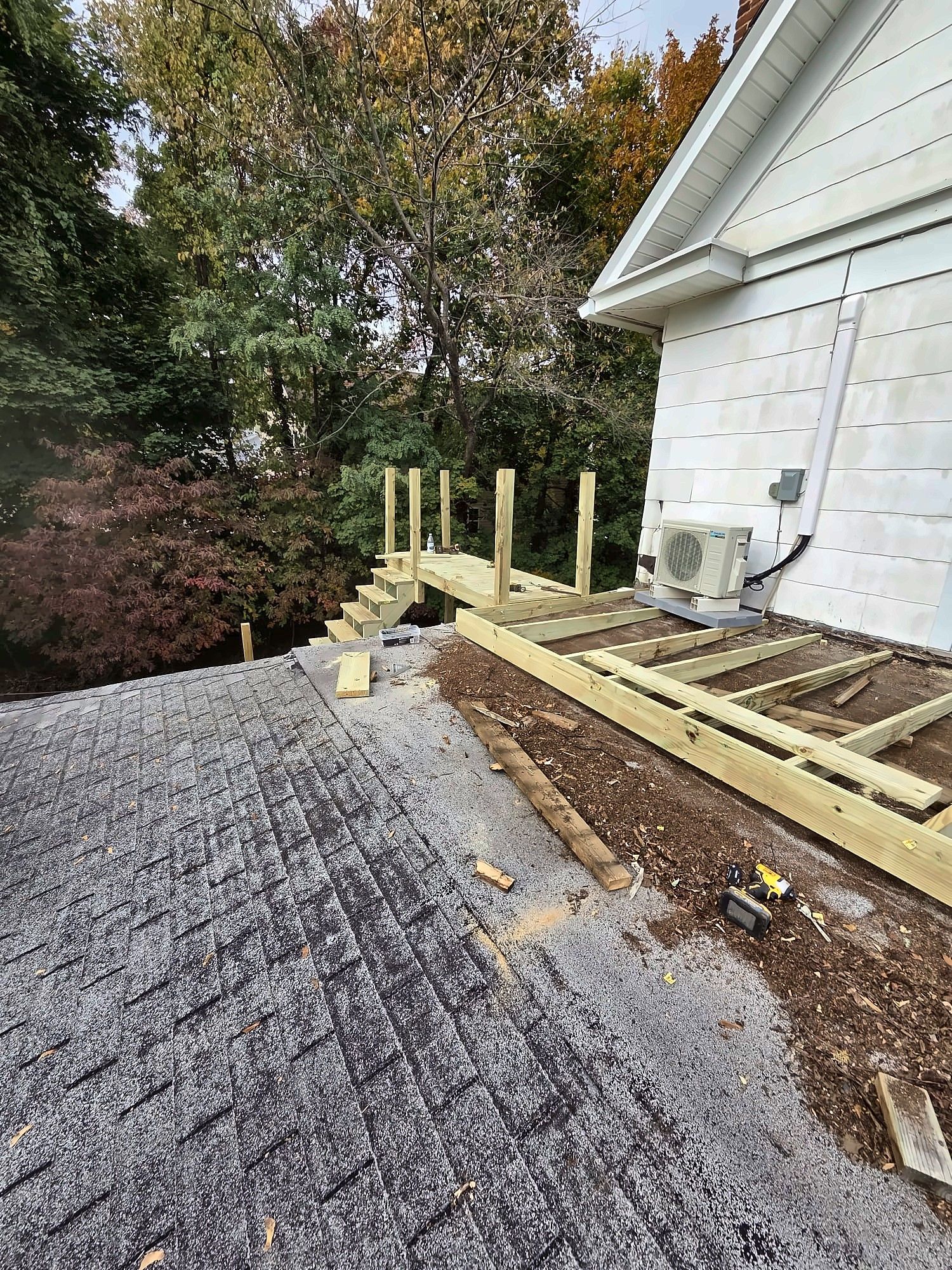 Framing a wood walkway over a low roof