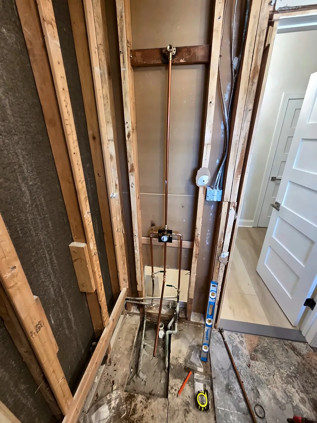 Bathroom gutted to studs with new supply lines and valve set