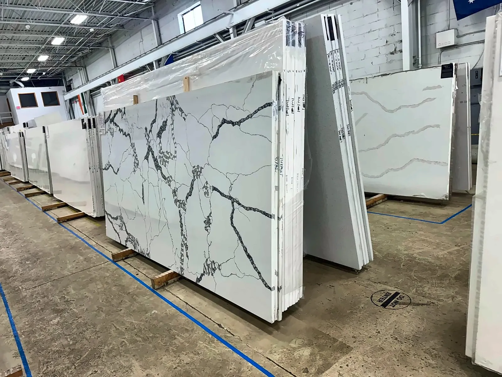 Quartz countertop slabs lined up at a stone yard