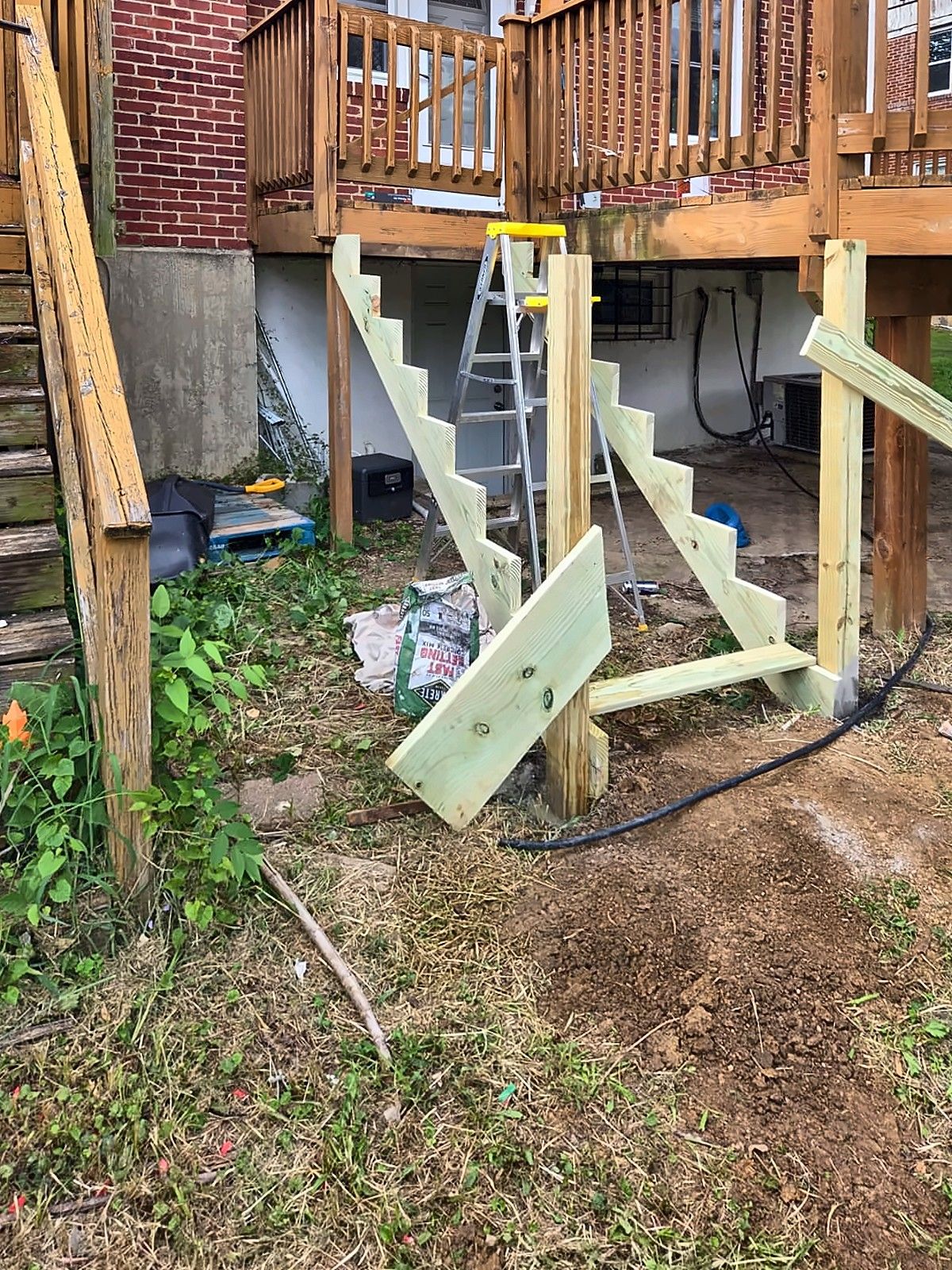 New rear deck stair stringers under construction