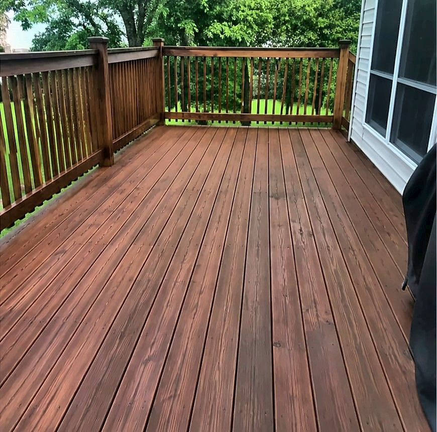 Freshly stained wood deck with railings