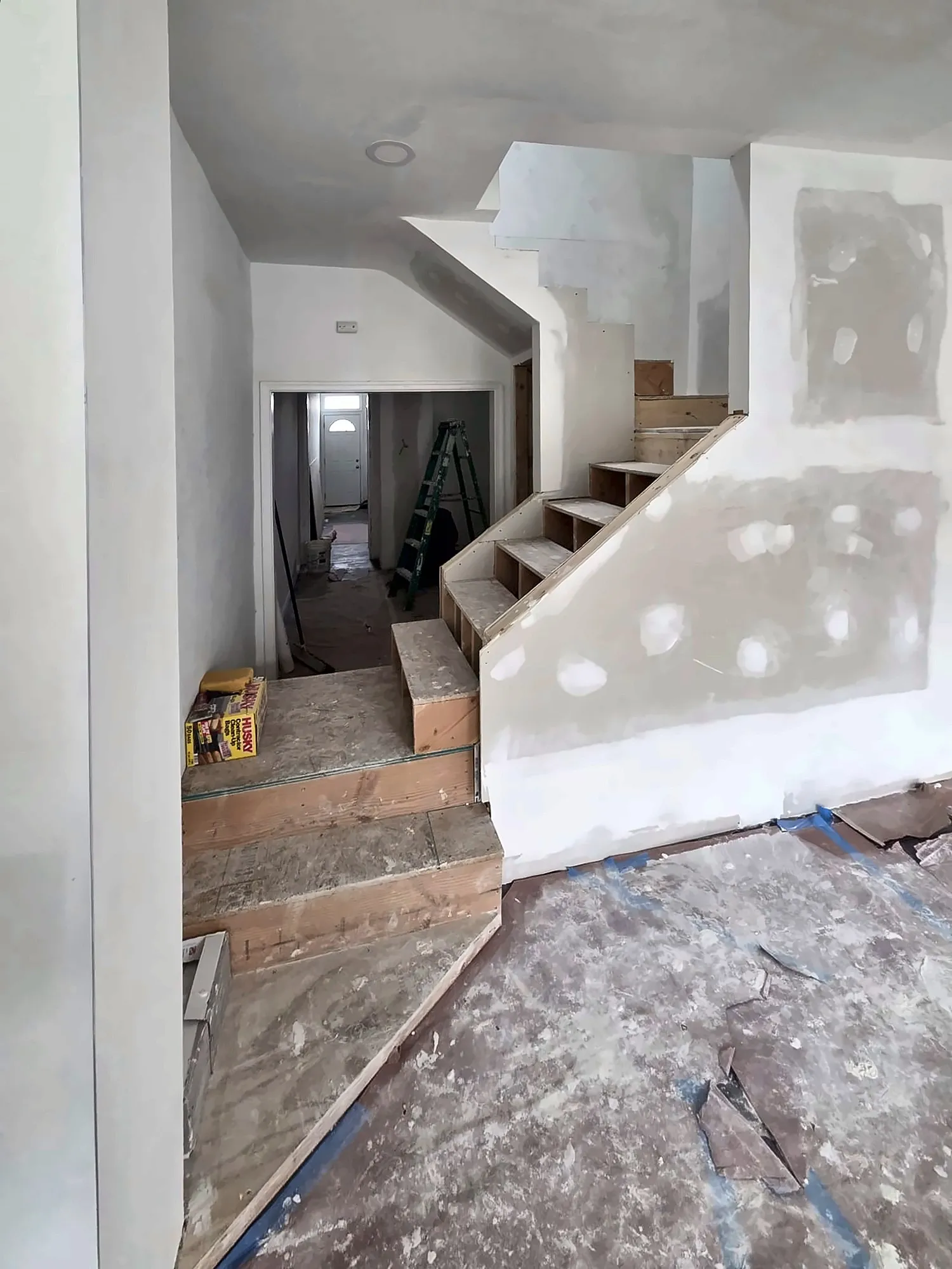 Staircase area during drywall repair